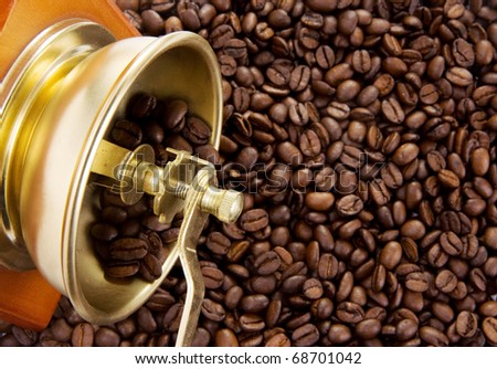 coffee grinder on roasted beans