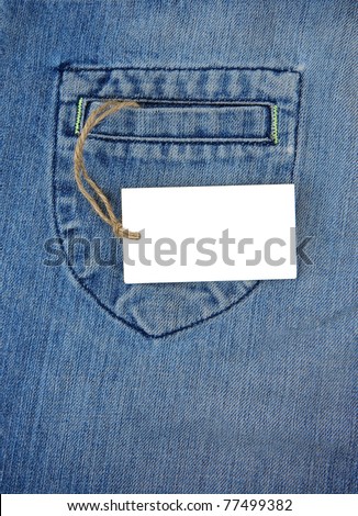 price tag label over blue jeans textured pocket