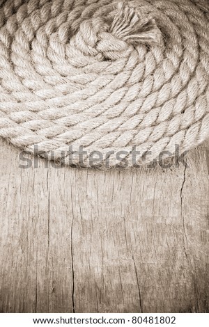 ship ropes and knot on wood background texture