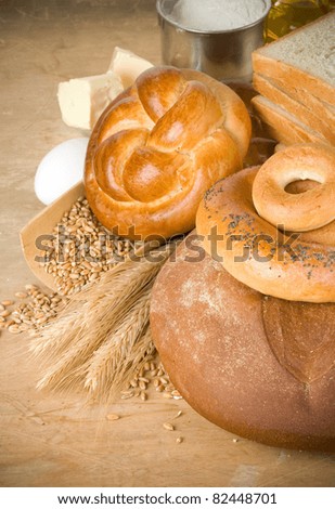 bread and grain on wood background