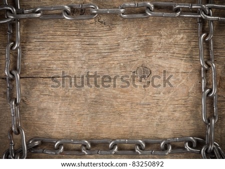 metal chain on old wood background texture