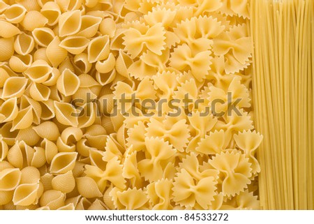 uncooked raw pasta as whole background