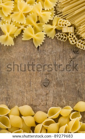 raw pasta at wood background texture