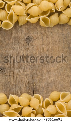 raw pasta on wood background texture