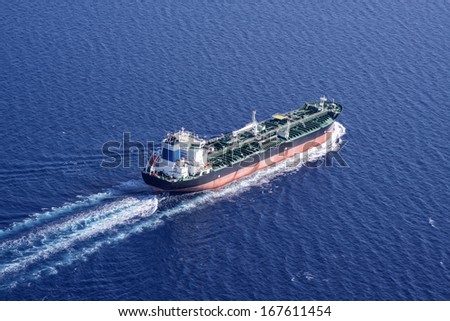 Aerial side view of oil tanker ship on open sea
