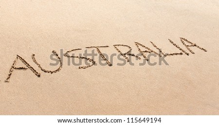 Australia written in the sand on a beautiful beach.