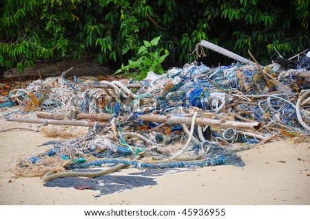 A rubbish dump of old fishing nets on a beach in Malaysia