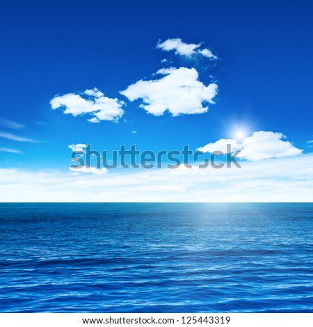 Blue sea and sky with sun. Sea summer shot