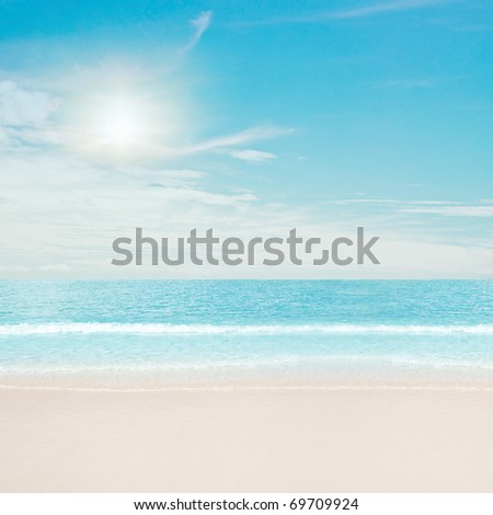 Tropical beach and ocean. Sun and clouds