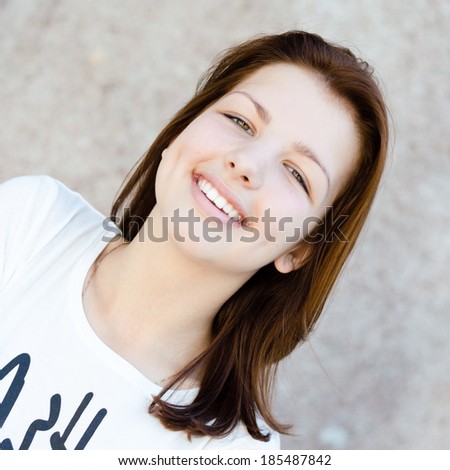 Young pretty woman happy smiling teenage girl head shot portrait