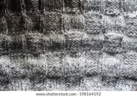woven hand made knit woolen design texture, knitting sweater or jumper gray copy space background detail closeup picture