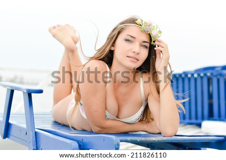 Sea mermaid enjoying summer: beauty model pretty girl having fun relaxing on sea pier, happy smiling & looking at camera, portrait