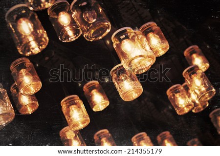 Lighting bulbs in glass jar decoration of Christmas market booth