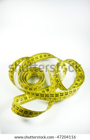 A yellow tape measure on a white background