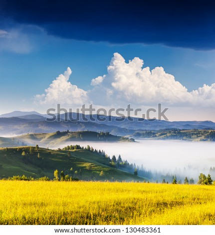 Morning sunny day is in mountain landscape. Overcast sky before storm. Carpathian, Ukraine, Europe.