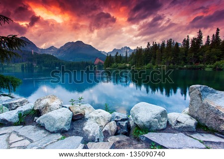 Mountain lake in National Park High Tatra. Dramatic overcrast sky. Strbske pleso, Slovakia, Europe. Beauty world.
