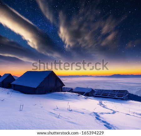 The Milky Way over the winter mountains landscape. Carpathian, Ukraine, Europe. Beauty world.