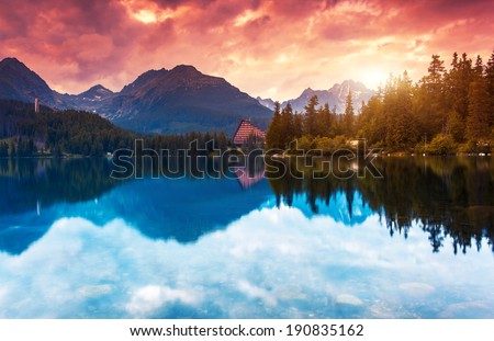 Mountain lake in National Park High Tatra. Dramatic overcast sky. Strbske pleso, Slovakia, Europe. Beauty world.