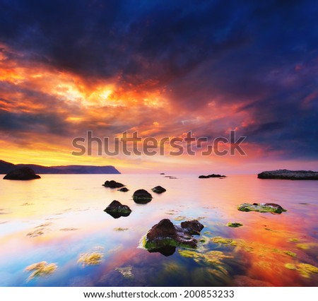 Fantastic sunset over the stormy sea. Dramatic overcast sky. Black Sea, Crimea, Ukraine, Europe. Beauty world.