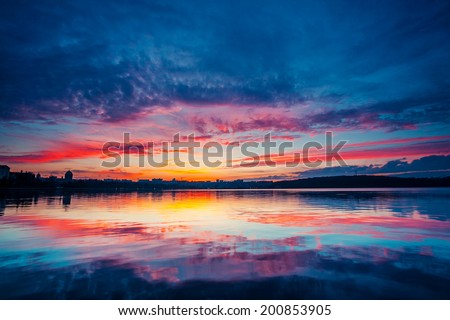 City in twilight. Fantastic colorful sunset and dark ominous clouds. Ternopil, Ukraine, Europe. Beauty world.