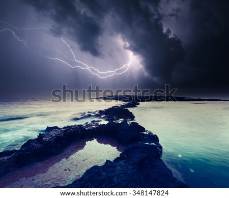 Dark ominous clouds. Thunderstorm with lightning. Volcanic island of Malta. Qawra, Europe. Beauty world.