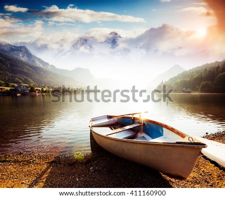 Fantastic views of the morning lake glowing by sunlight. Dramatic and picturesque scene. Location: resort Grundlsee, Liezen District of Styria, Austria, Alps. Europe. Beauty world. Instagram effect.