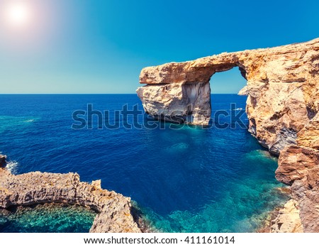 Fantastic views of rocky coast on a sunny day with blue sky. Picturesque and gorgeous scene. Location famous place Azure Window, Gozo island, Dwejra. Malta. Europe. Mediterranean sea. Beauty world.