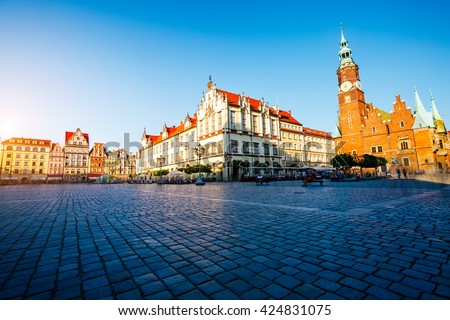 Fantastic view of the ancient homes on a sunny day. Gorgeous picture and picturesque scene. Location famous Market Square in Wroclaw, Poland, Europe. Historical capital of Silesia. Beauty world.