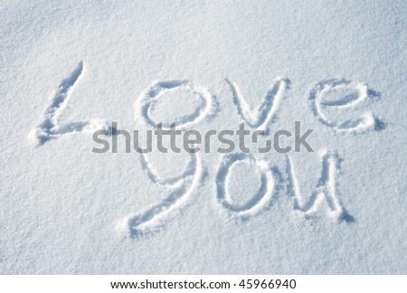 writing text LOVE YOU on the snow