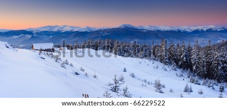 Sunrise in the mountains in winter on a cold morning. Mountain house