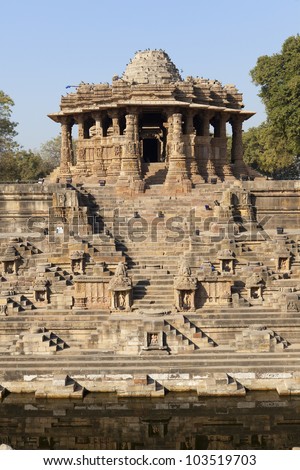A stepped water tank/step-well infront of the Sun Temple at Modhera. Ruined Hindu temple Gujarat, India.