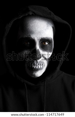 Scary skeleton on black background.