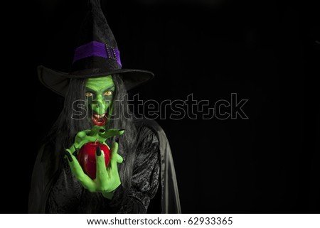 Scary witch with a poisonous apple.