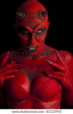 Red devil sexy woman, low key lighting.