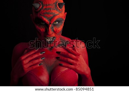 Sexy red devil woman, black background.