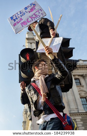 LONDON, UK - DECEMBER 9: Students protest in Parliament Square as MP\'s vote in Parliament to raise student fees on December 9, 2010 in London, UK.