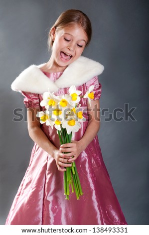 Cute girl with narcissus