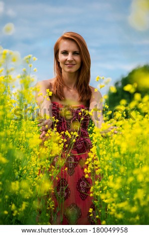 Beautiful young woman  in a raps field