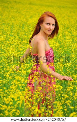 Beautiful young woman in a raps field