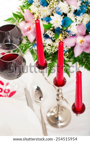 Table served with candles and wine