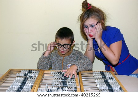 boy and book-keeper with abacus