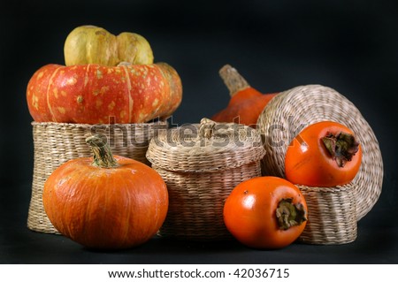 wicker box with pumpkins and persimmon