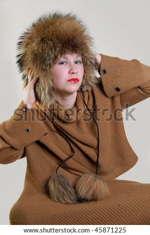 Beautiful woman in the raccoon fur cap