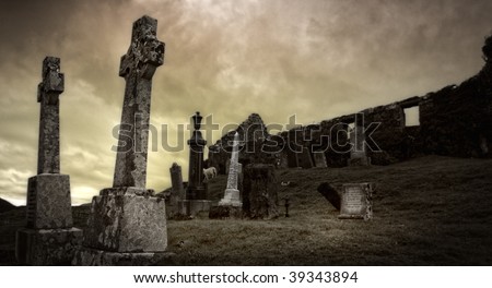 Spooky graveyard surrounding ancient ruin on Isle of Skye, Scotland