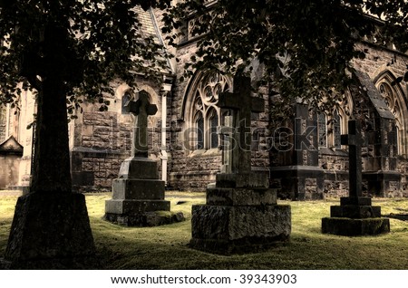 Spooky graveyard surrounding ancient church, Scotland