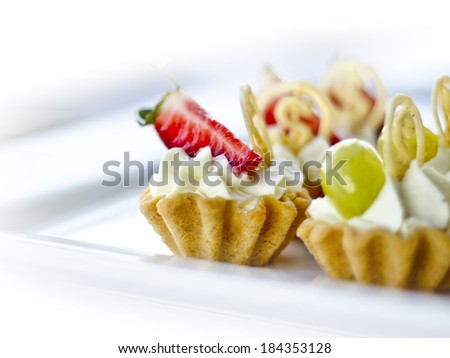 tasty snacks pastry with custard and fruit on a white background