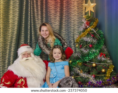 Santa Claus with Christmas wishes of people in the room