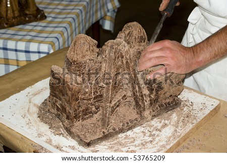 Close-up on a chocolate sculptor hands