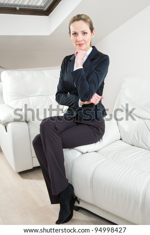 Young successful businesswoman on the couch