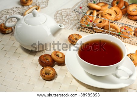 Photo of a tea mug and teapot with black tea